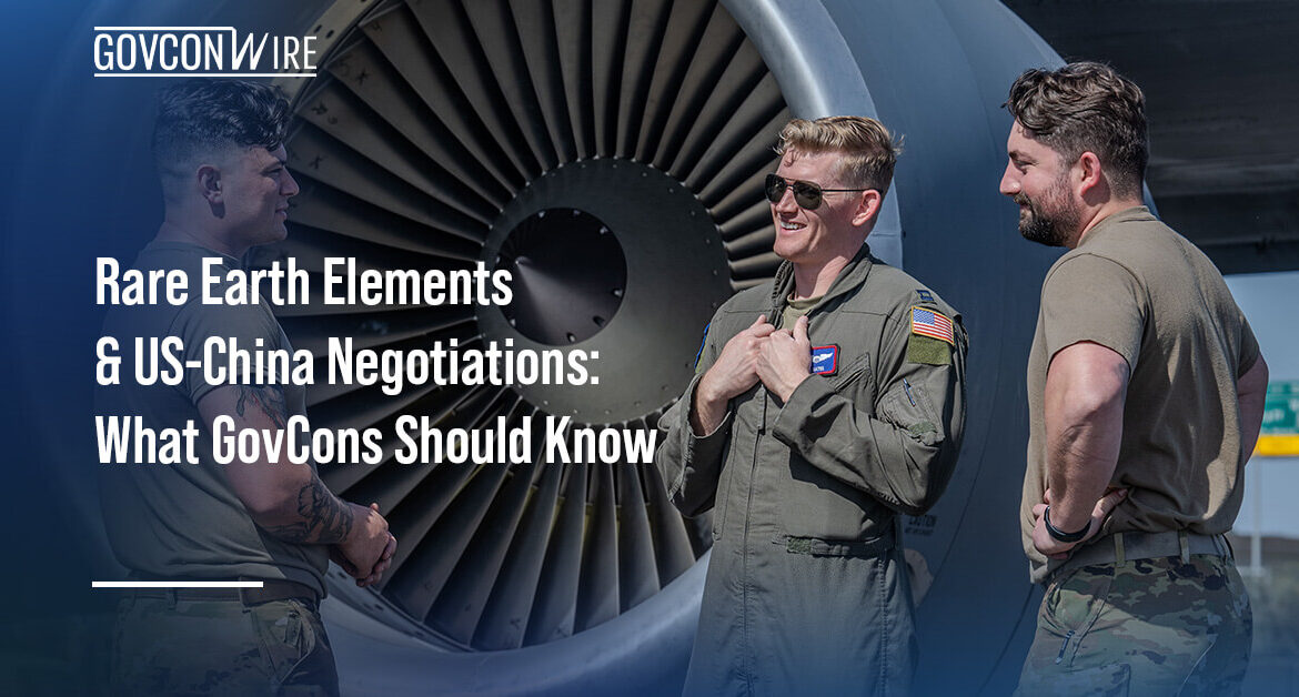 Airmen standing near a KC-135 engine. Rare earth elements are highly desired for their performance in extreme conditions