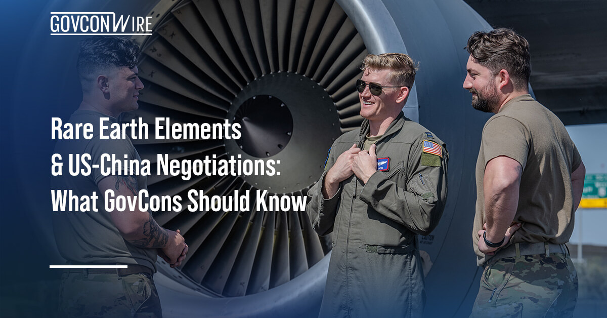 Airmen standing near a KC-135 engine. Rare earth elements are highly desired for their performance in extreme conditions