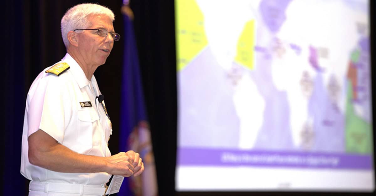 Photo of Navy Vice Adm. Karl Thomas delivering his keynote address at the 2025 Navy Summit.